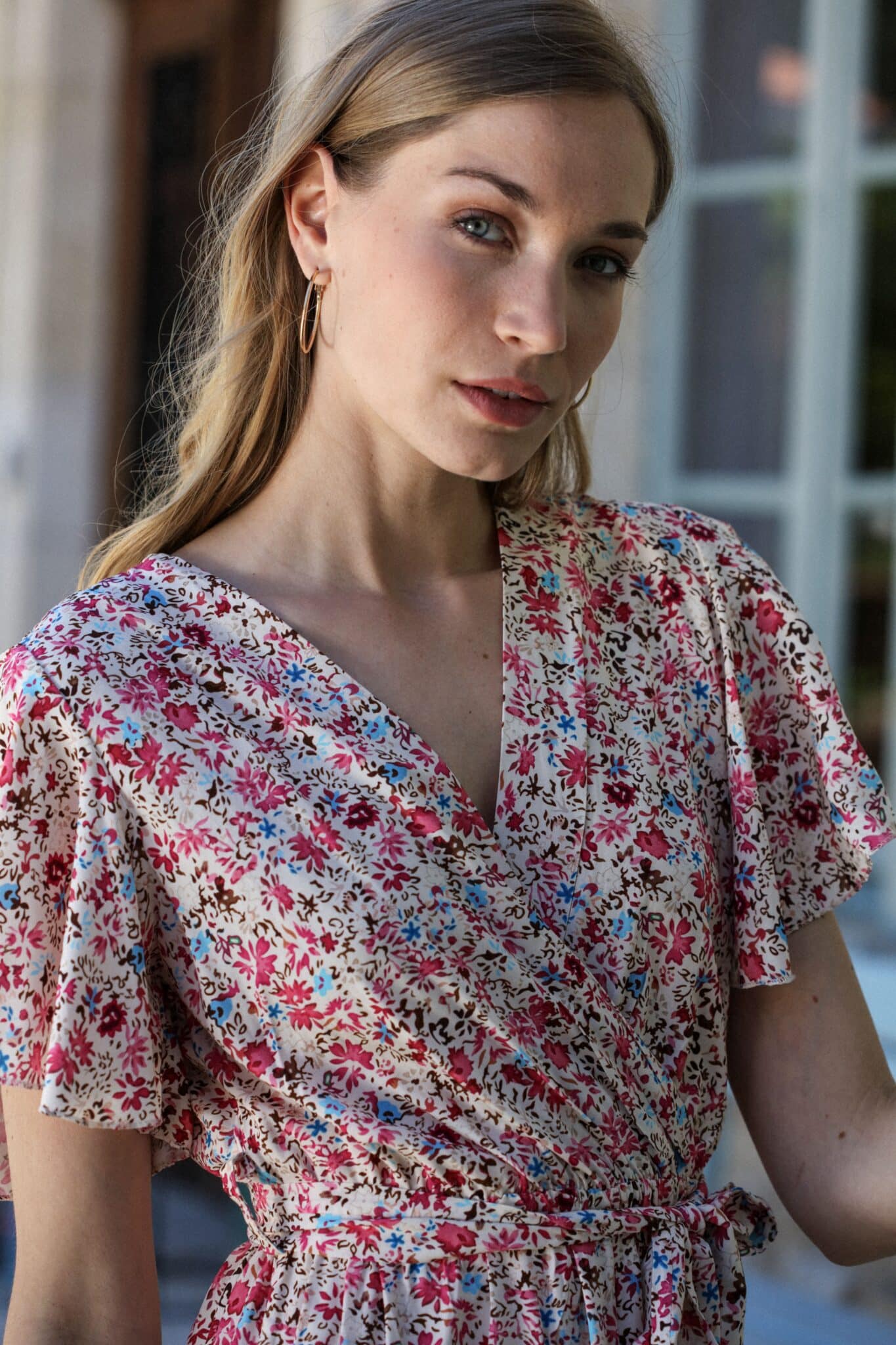 Shooting model wearing our floral jumpsuit Pink butterfly sleeves