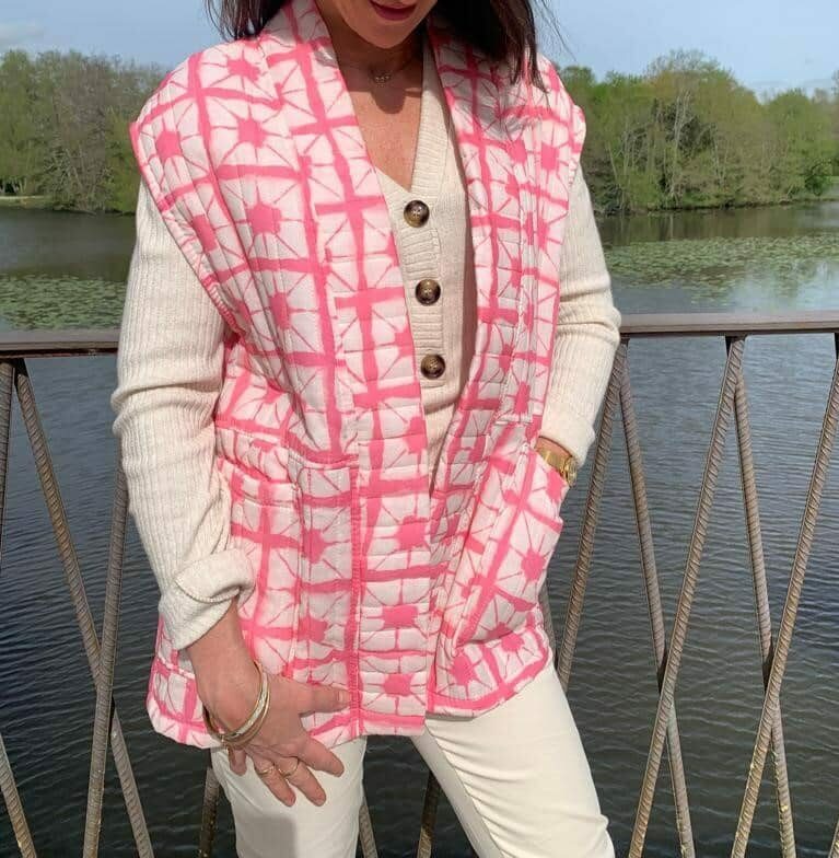 Pink sleeveless quilted jacket with pockets