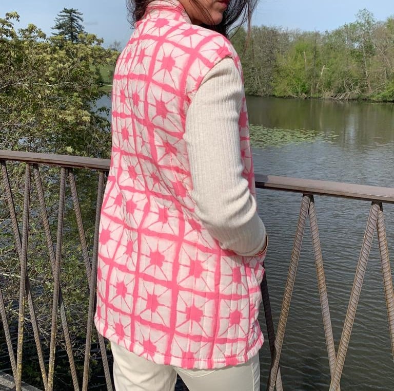 Pink sleeveless quilted jacket