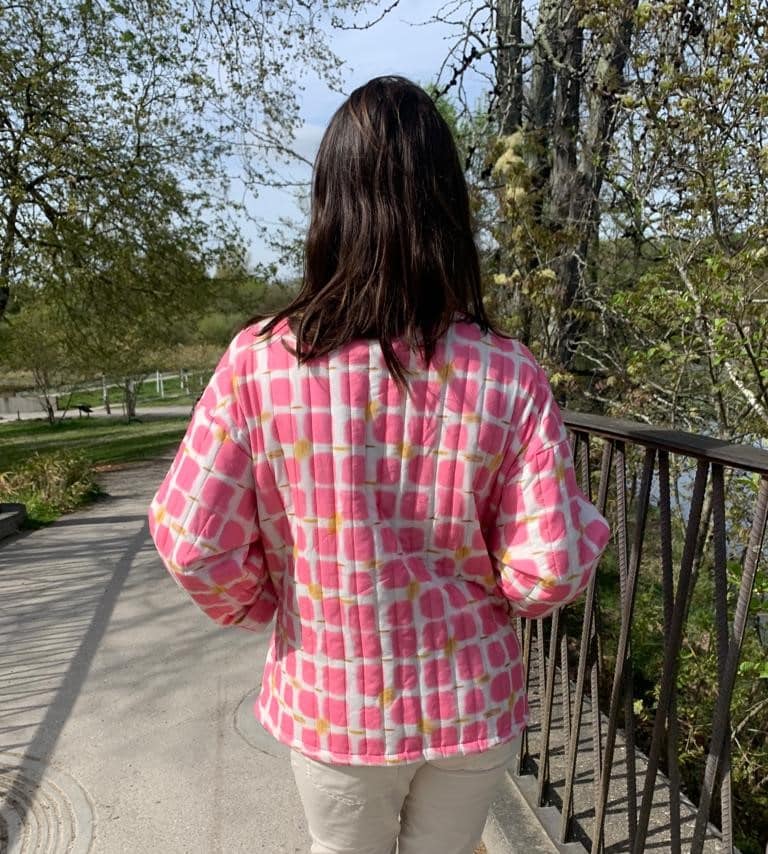 fluorescent pink quilted jacket printed with long sleeves and back plated pockets