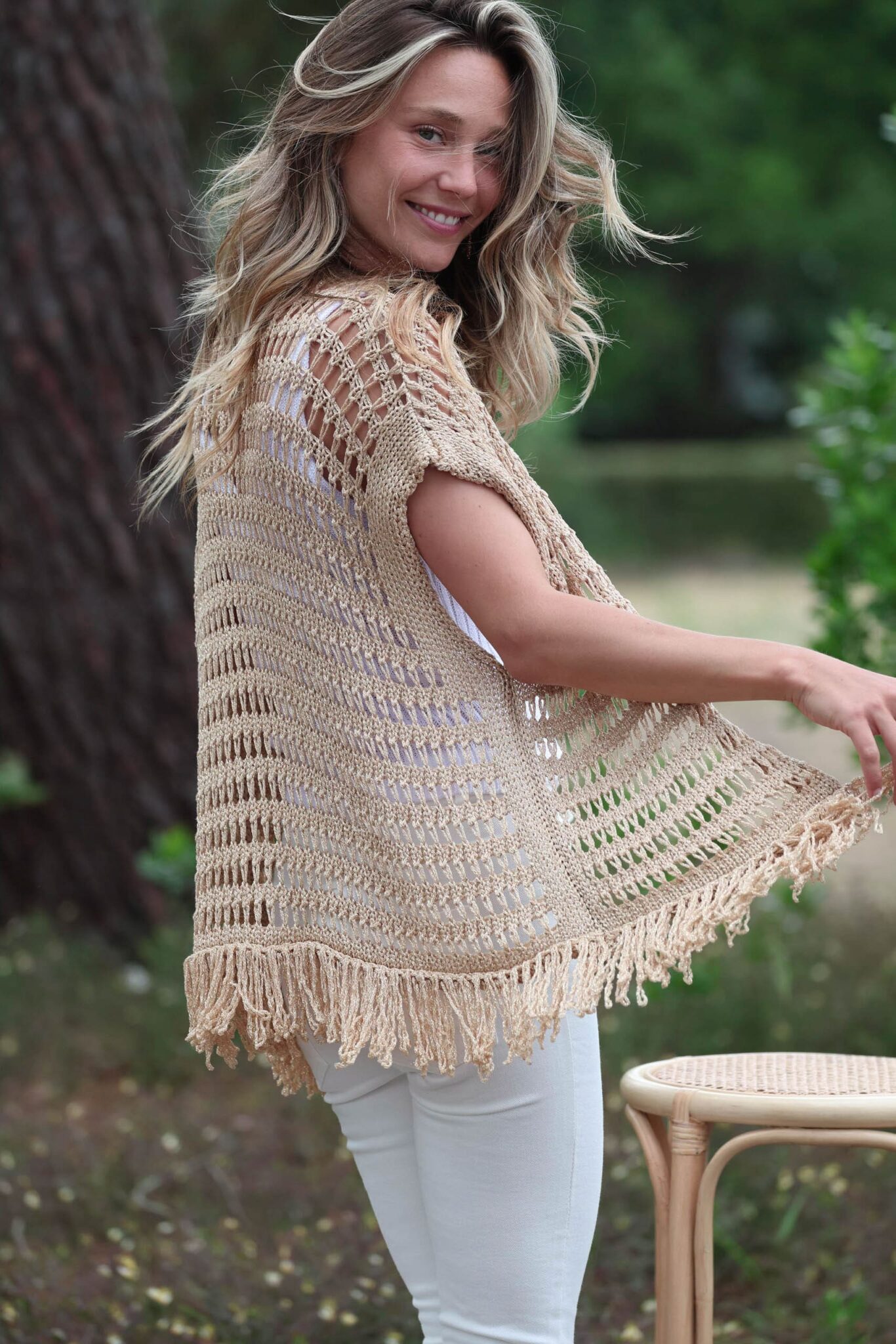 Golden vest with back fringes with white trousers